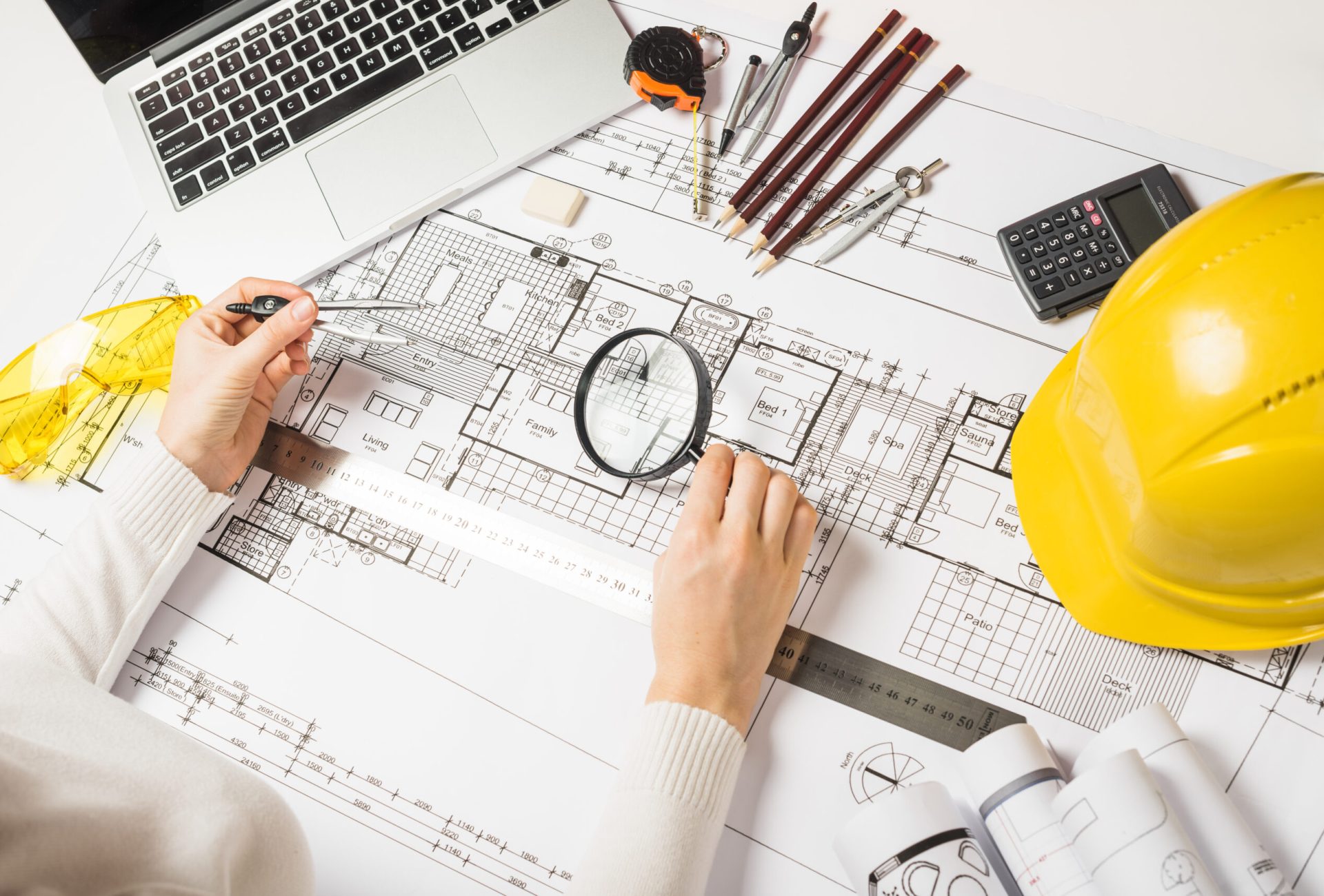 architect-making-plan-with-loupe architect-making-plan-with-loupe